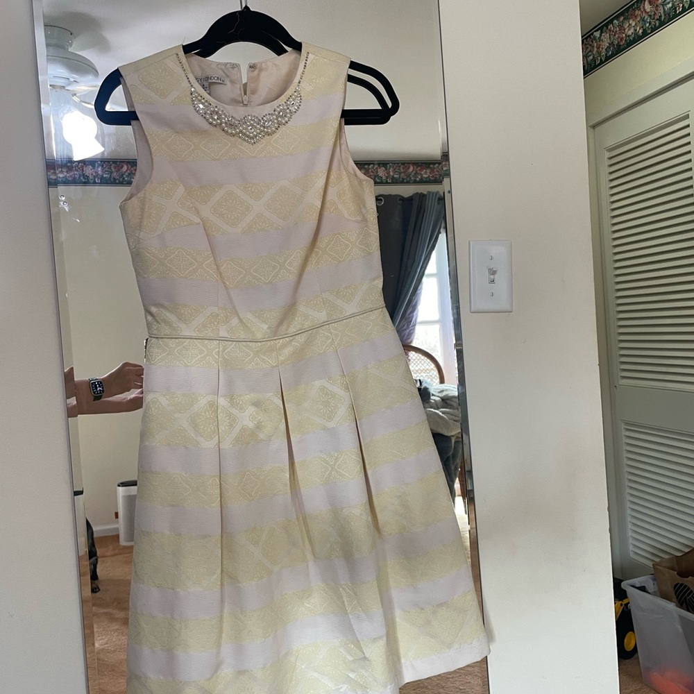 Elegant Cream and Pale Yellow Striped Fit-and-Flare Dress with Embellished Colla